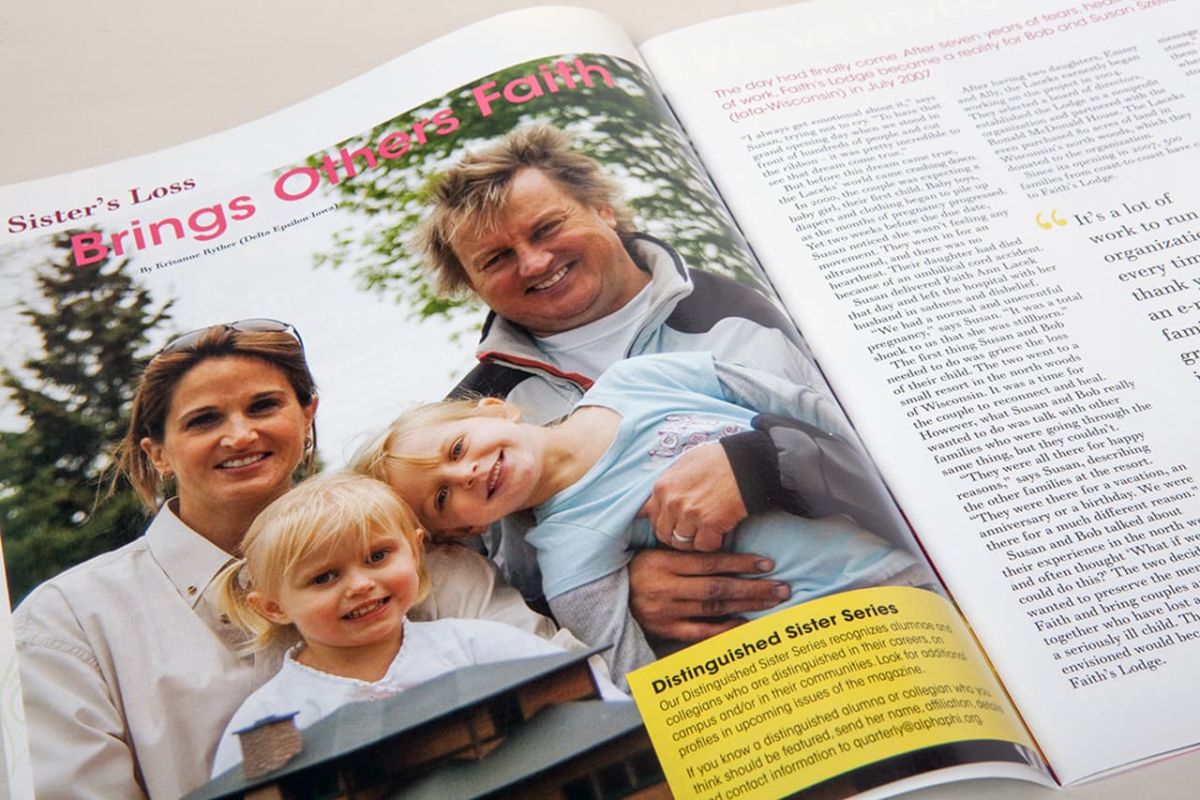 an open copy of the quarterly the page is showing a photo of a smiling family