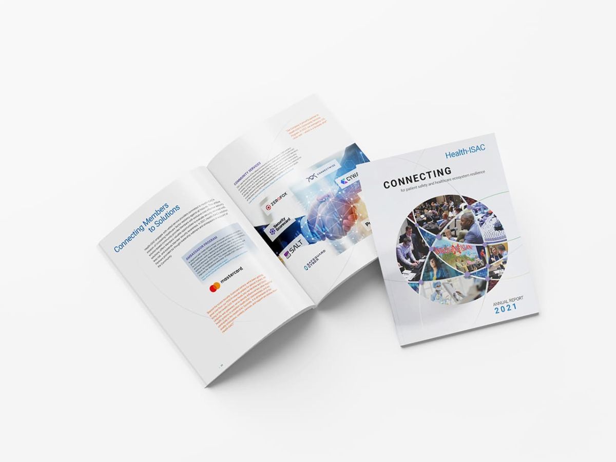 Two copies of the annual report side by side one closed and one opened